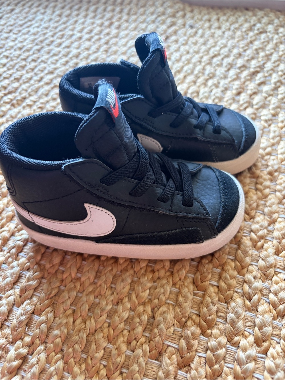 Nike Kids Black Sneakers with White Swoosh and Pink Accent